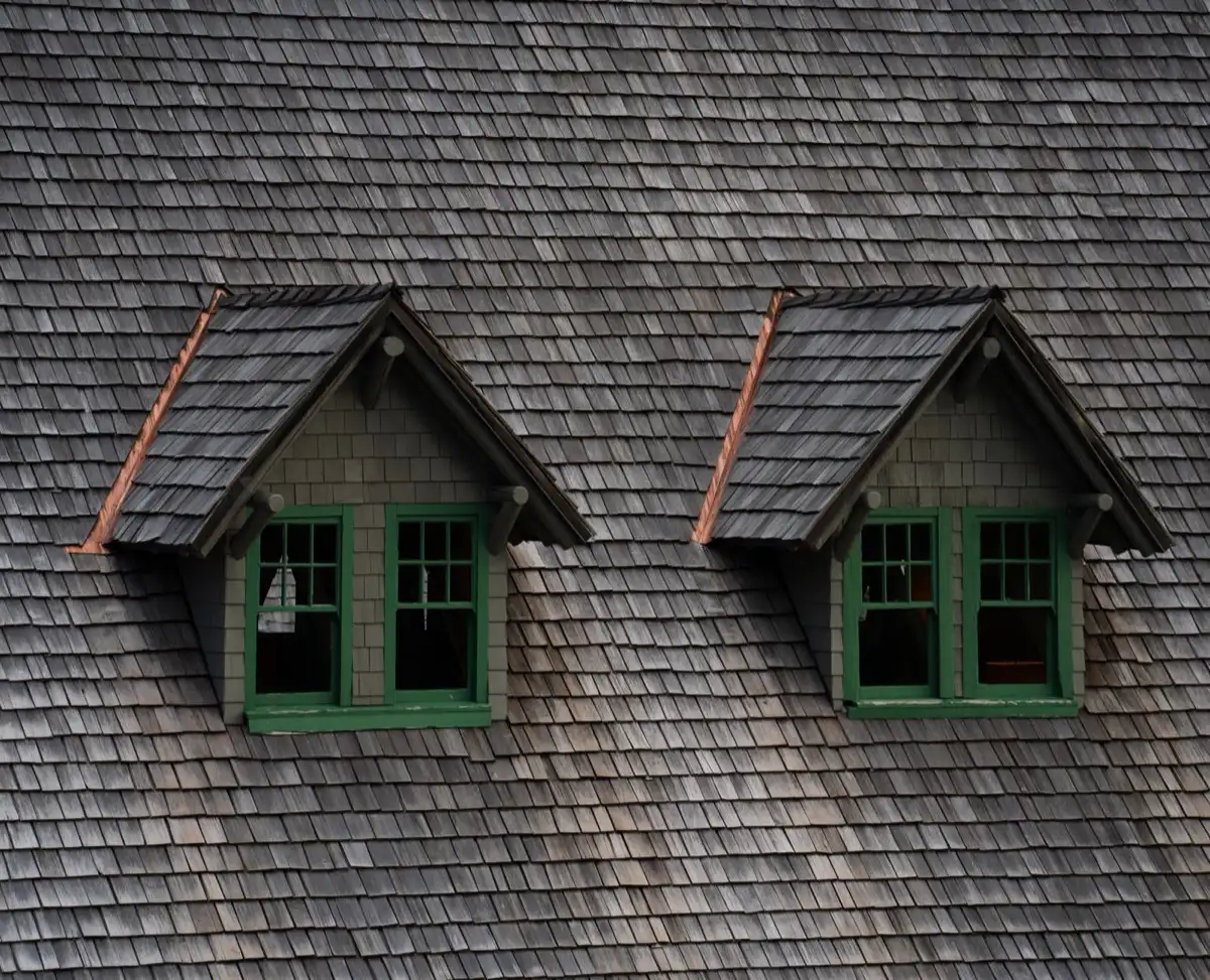 Dormers on a shingle roof in Joliet, IL, where step flashing and kickout flashing carry water past the walls
