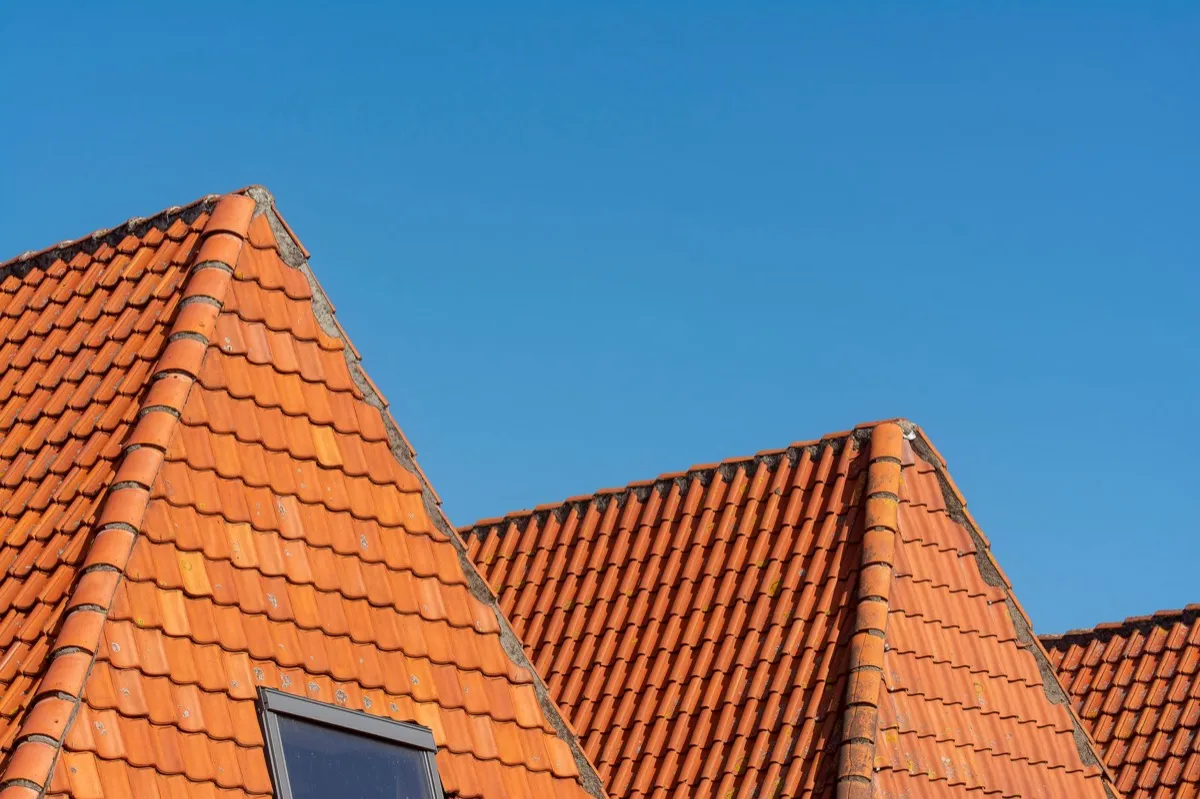 Clay barrel tile rooflines on homes in Joliet, IL
