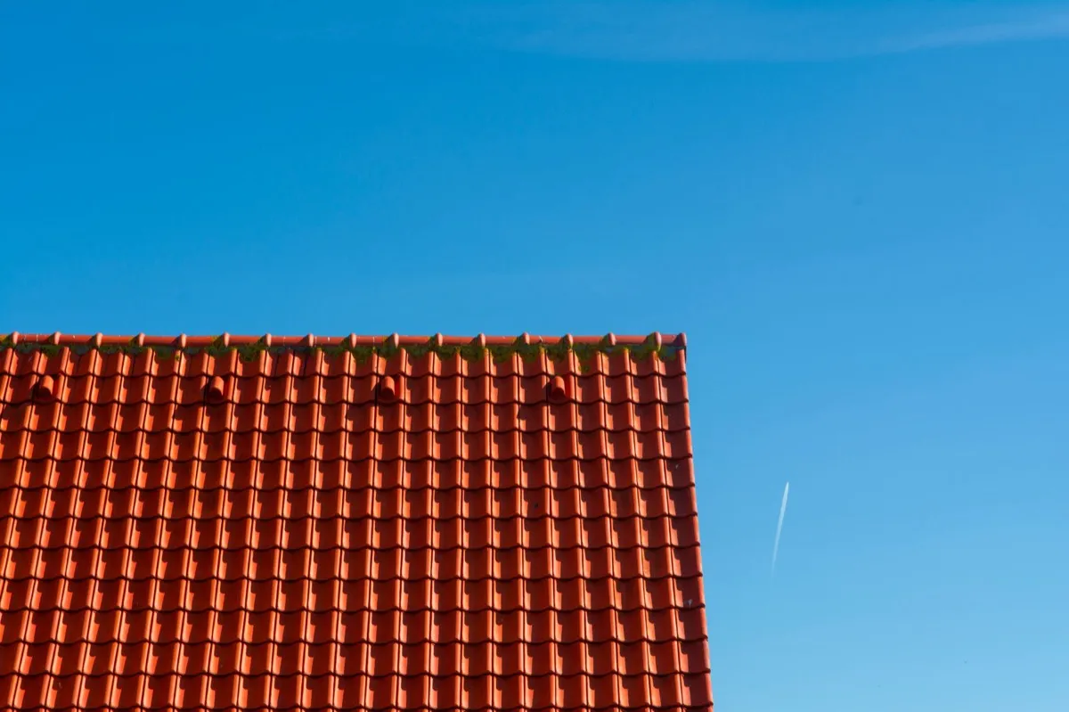 Tile roof gable in full sun, the kind of exposure that sets roof life in Joliet, IL